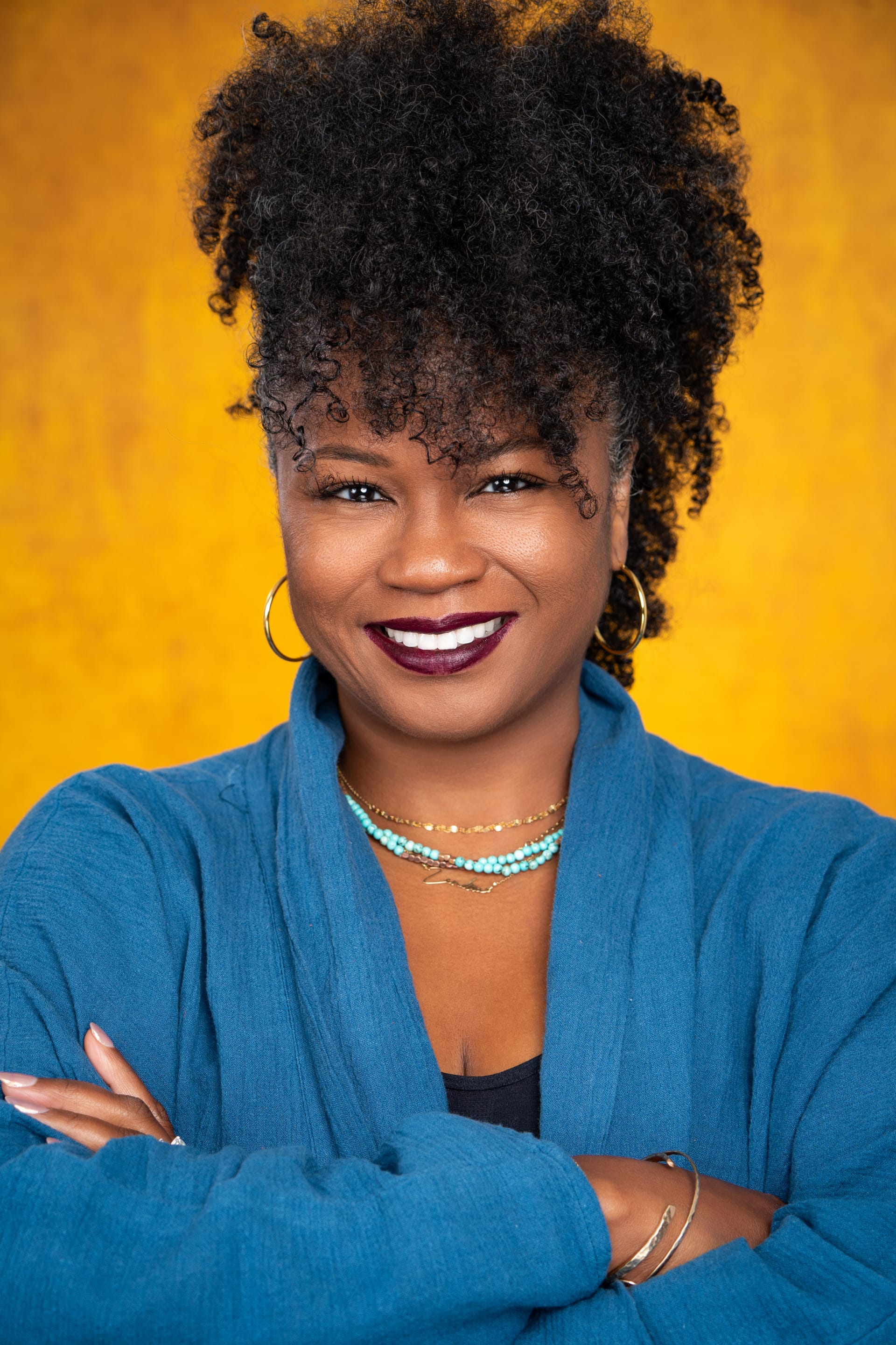 Portrait of the founder of Get Even Yoga smiling softly